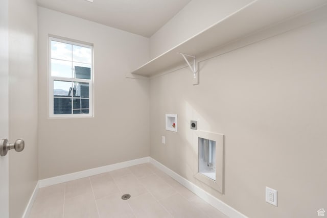 6658 W Spring Snow Ln, Herriman, UT 84096 - clothes washing area featuring hookup for an electric dryer, baseboards, light tile patterned flooring, laundry area, and hookup for a washing machine