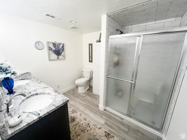 2770 S 9500 E, Jensen, UT 84035 - full bath featuring a shower stall, visible vents, a sink, and wood finish floors