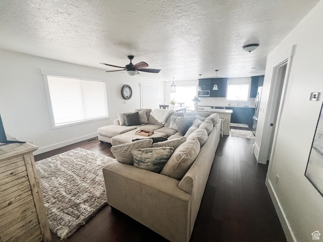 2770 S 9500 E, Jensen, UT 84035 - living area with ceiling fan, a textured ceiling, baseboards, and dark wood finished floors