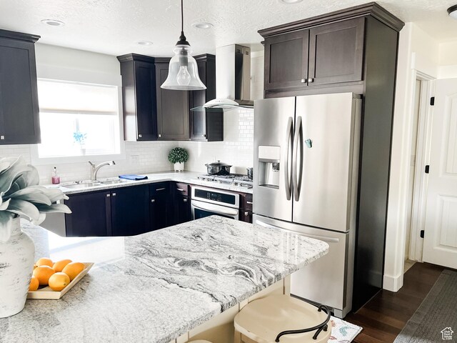 2770 S 9500 E, Jensen, UT 84035 - kitchen with wall chimney exhaust hood, tasteful backsplash, appliances with stainless steel finishes, dark wood-style flooring, and a sink