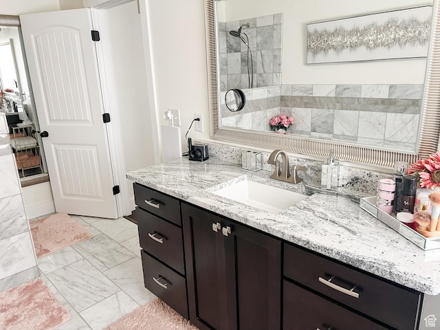 2770 S 9500 E, Jensen, UT 84035 - bathroom with tiled shower, marble finish floor, and vanity