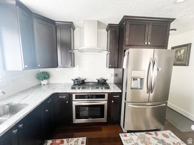 2770 S 9500 E, Jensen, UT 84035 - kitchen with tasteful backsplash, wall chimney range hood, dark wood-style floors, light stone countertops, and stainless steel appliances