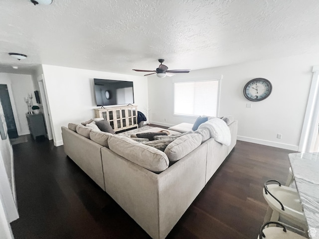 2770 S 9500 E, Jensen, UT 84035 - living area with dark wood-type flooring, a textured ceiling, ceiling fan, and baseboards