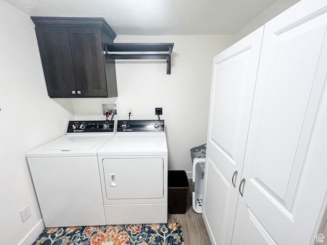 2770 S 9500 E, Jensen, UT 84035 - washroom featuring cabinet space, washing machine and dryer, and wood finished floors