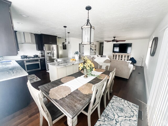 2770 S 9500 E, Jensen, UT 84035 - dining area with ceiling fan, a textured ceiling, and dark wood finished floors