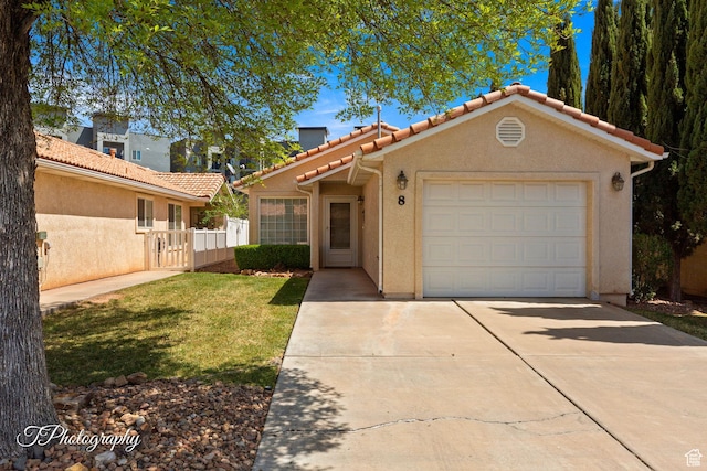 1360 E Telegraph St # 8, Washington, UT 84780 - view of front of home with an attached garage, driveway, stucco siding, and a tile roof