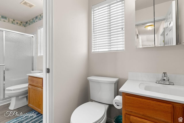 1360 E Telegraph St # 8, Washington, UT 84780 - bathroom with visible vents, toilet, vanity, and a shower with shower door