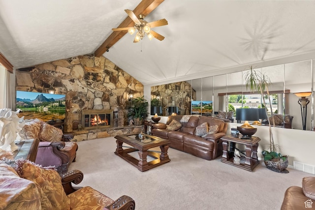 living area with a fireplace, a ceiling fan, visible vents, carpet flooring, and vaulted ceiling with beams