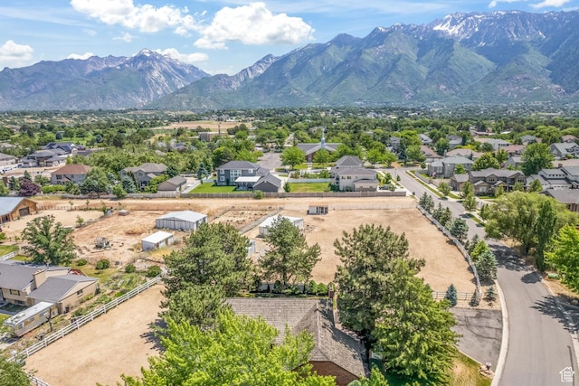 drone / aerial view featuring a residential view and a mountain view