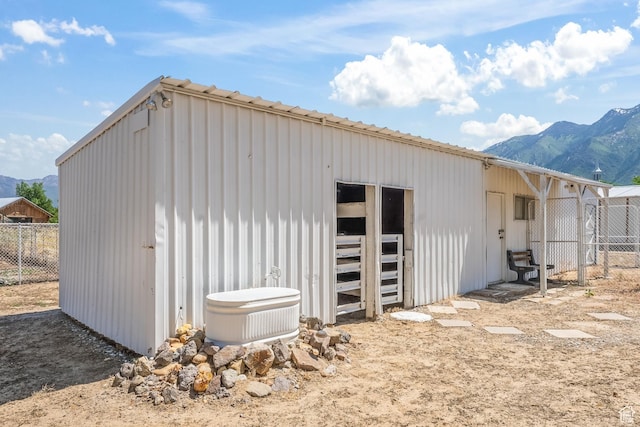 view of outbuilding with an outdoor structure and a mountain view