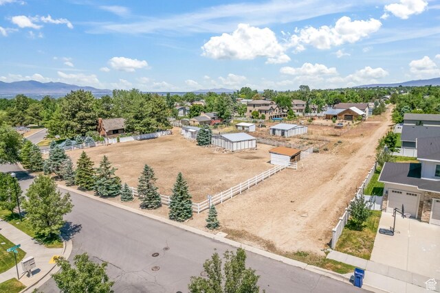 birds eye view of property featuring a mountain view