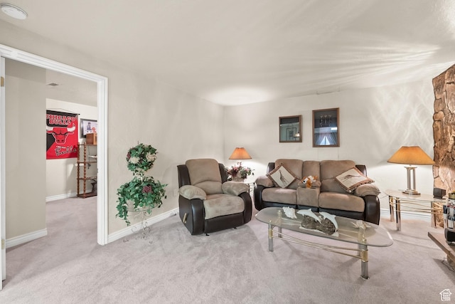carpeted living room featuring baseboards