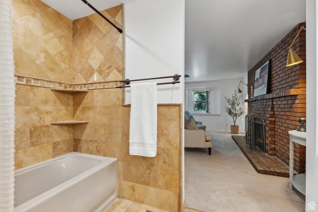 full bath featuring shower / bath combination and a brick fireplace