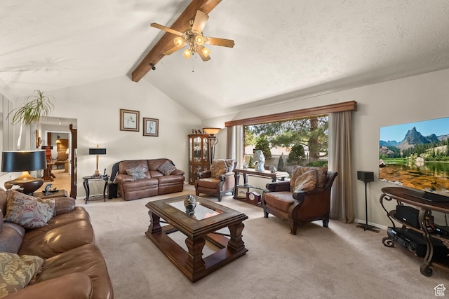 living room with light carpet, vaulted ceiling with beams, a ceiling fan, and a textured ceiling