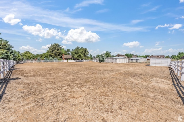 view of yard with fence and an enclosed area
