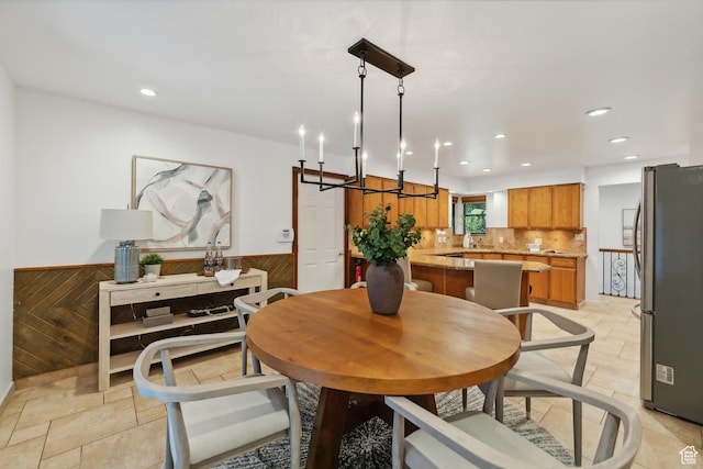 dining area featuring wooden walls, a wainscoted wall, and recessed lighting