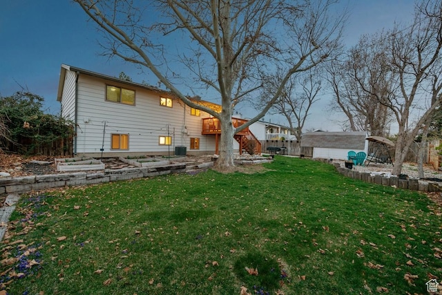 rear view of house with central air condition unit, an outdoor structure, a lawn, and a storage unit