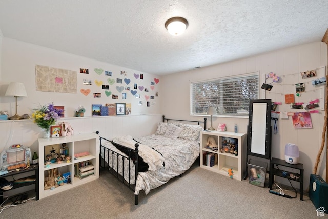 carpeted bedroom with a textured ceiling