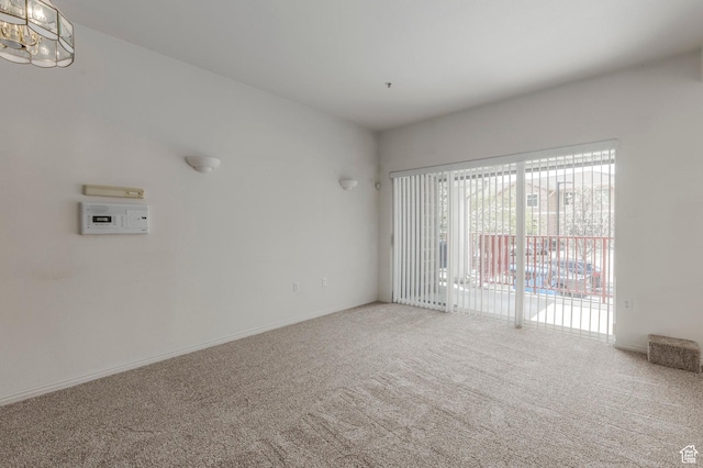 11035 S Grapevine Cv Unit 101, Sandy, UT 84070 - carpeted spare room with baseboards and a chandelier