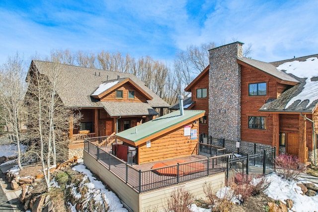 3931 Timber Wolf Ln Unit 7C, Park City, UT 84098 - snow covered back of property featuring a chimney