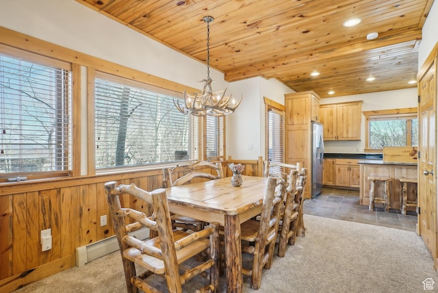 3931 Timber Wolf Ln Unit 7C, Park City, UT 84098 - dining space with wooden walls, a notable chandelier, light colored carpet, and wooden ceiling