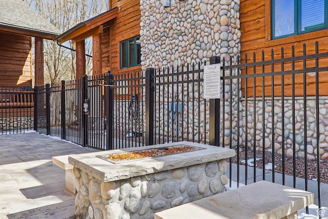 3931 Timber Wolf Ln Unit 7C, Park City, UT 84098 - exterior space featuring a fire pit and a fenced front yard