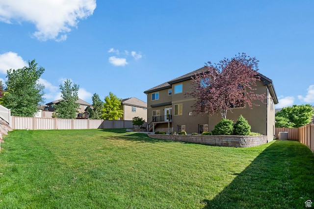view of yard with a fenced backyard