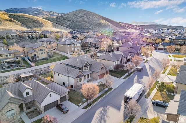 birds eye view of property featuring a mountain view and a residential view