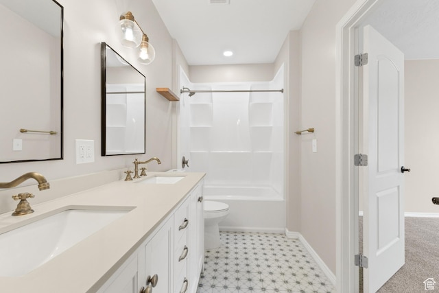 bathroom featuring a sink, tile patterned floors, double vanity, and baseboards