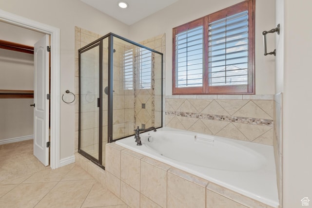 bathroom with a shower stall, tile patterned flooring, a bath, and recessed lighting
