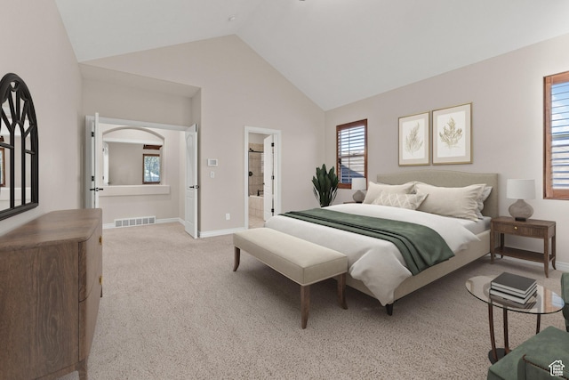 bedroom featuring visible vents, baseboards, carpet flooring, and connected bathroom