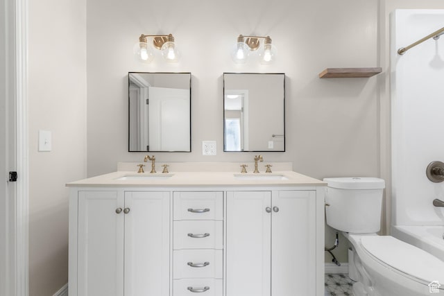 full bath with double vanity, a sink, toilet, and shower / washtub combination