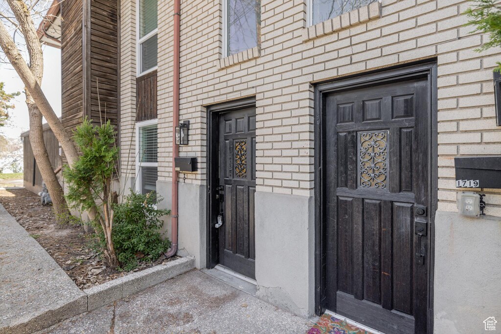entrance to property with brick siding