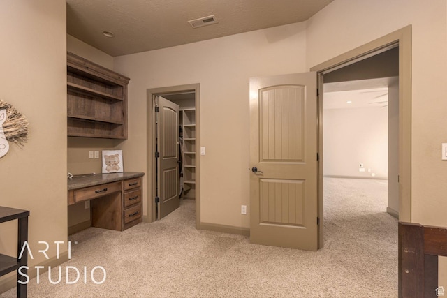 1285 Summerwood Cir, Santa Clara, UT 84765 - interior space with carpet floors, baseboards, a walk in closet, and visible vents