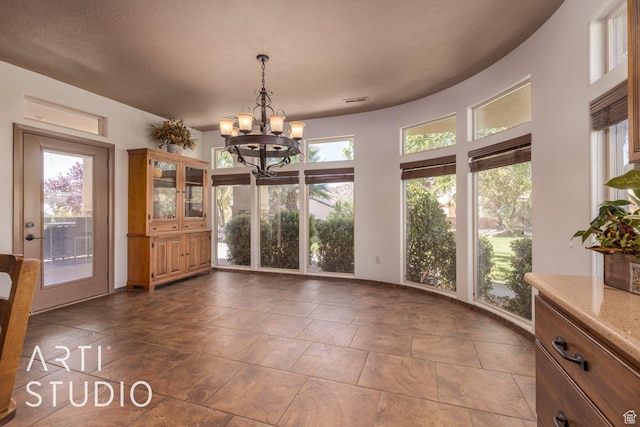 1285 Summerwood Cir, Santa Clara, UT 84765 - unfurnished dining area featuring an inviting chandelier, baseboards, and visible vents