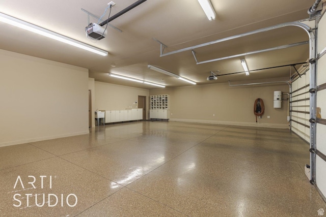 1285 Summerwood Cir, Santa Clara, UT 84765 - garage featuring a garage door opener and baseboards