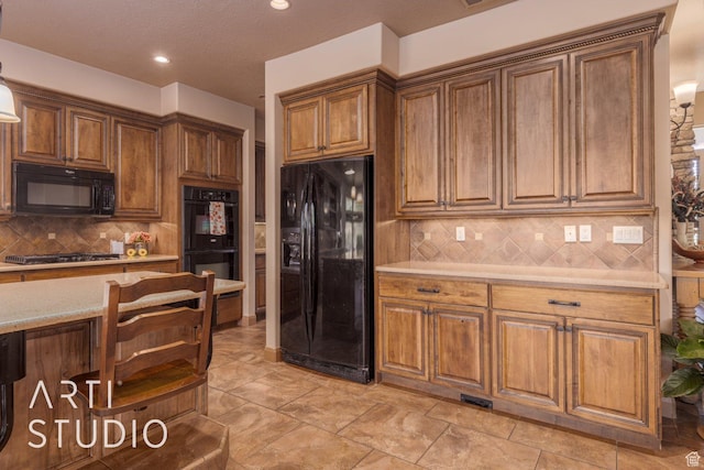 1285 Summerwood Cir, Santa Clara, UT 84765 - kitchen featuring tasteful backsplash, recessed lighting, visible vents, brown cabinets, and black appliances