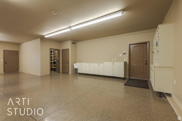 1285 Summerwood Cir, Santa Clara, UT 84765 - garage with baseboards and visible vents