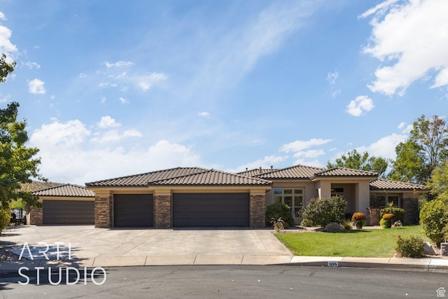 1285 Summerwood Cir, Santa Clara, UT 84765 - view of front of home with a tiled roof, stone siding, a garage, stucco siding, and driveway