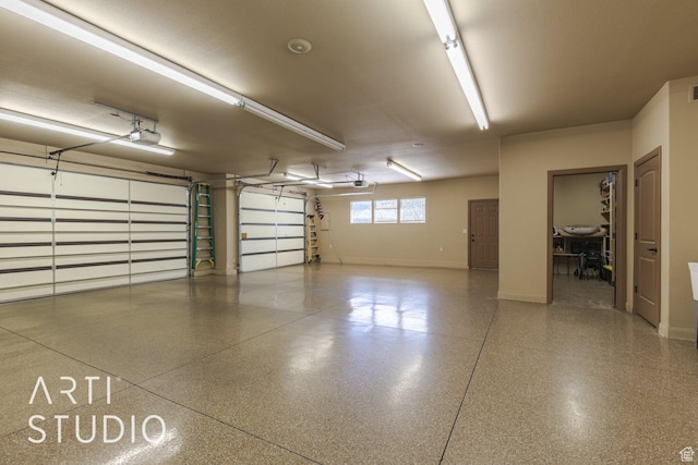 1285 Summerwood Cir, Santa Clara, UT 84765 - garage with baseboards and a garage door opener