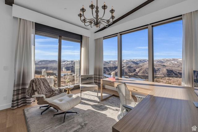 2178 E Lone Peak Ln, Kamas, UT 84036 - interior space featuring an inviting chandelier, wood finished floors, lofted ceiling, a mountain view, and baseboards