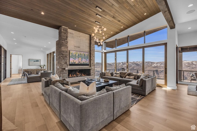 2178 E Lone Peak Ln, Kamas, UT 84036 - living area featuring a mountain view, light wood-style floors, wooden ceiling, and high vaulted ceiling