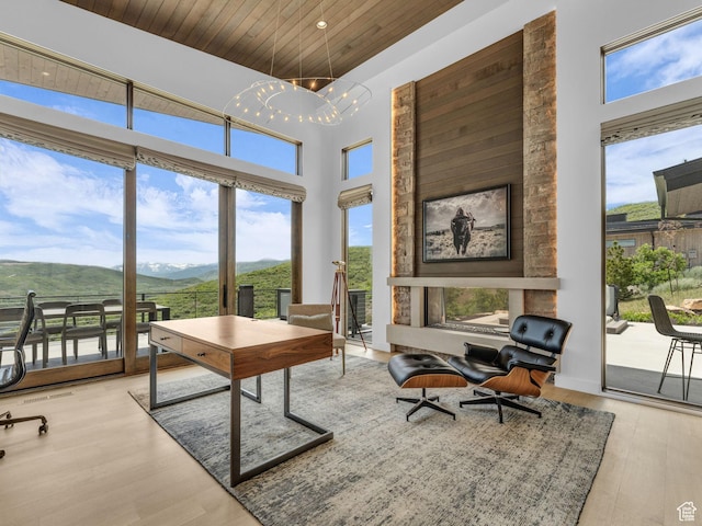 2178 E Lone Peak Ln, Kamas, UT 84036 - office area with a mountain view, wood ceiling, wood finished floors, a towering ceiling, and a chandelier