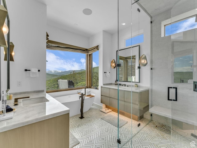 2178 E Lone Peak Ln, Kamas, UT 84036 - bathroom featuring vanity, a freestanding tub, a stall shower, a mountain view, and tile patterned flooring