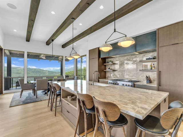 2178 E Lone Peak Ln, Kamas, UT 84036 - kitchen featuring open shelves, a sink, modern cabinets, backsplash, and beam ceiling