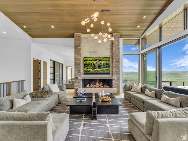 2178 E Lone Peak Ln, Kamas, UT 84036 - living area with wooden ceiling, a chandelier, a fireplace, recessed lighting, and wood finished floors