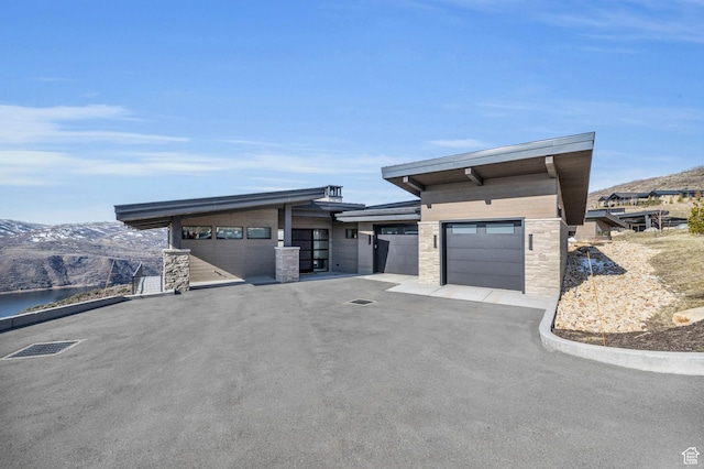 2178 E Lone Peak Ln, Kamas, UT 84036 - exterior space featuring a mountain view, an attached garage, and driveway