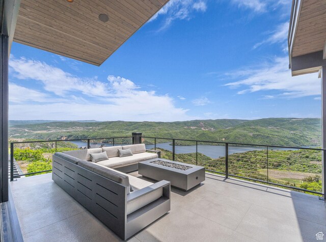 2178 E Lone Peak Ln, Kamas, UT 84036 - view of patio featuring a water and mountain view and an outdoor living space with a fire pit
