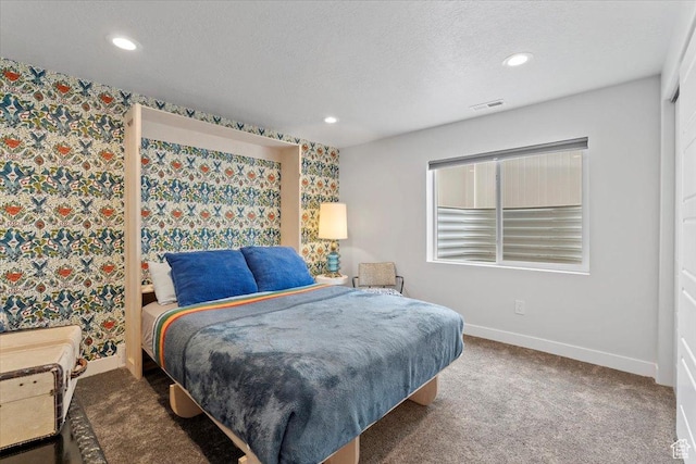 bedroom with carpet, a textured ceiling, visible vents, recessed lighting, and baseboards