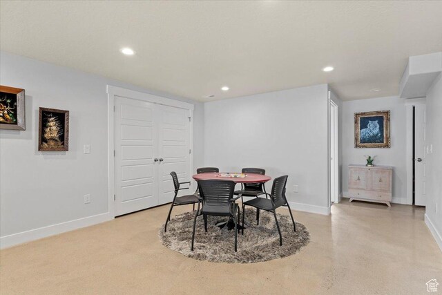 dining space featuring baseboards and recessed lighting